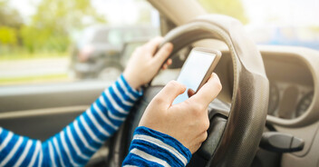 A person texting while driving